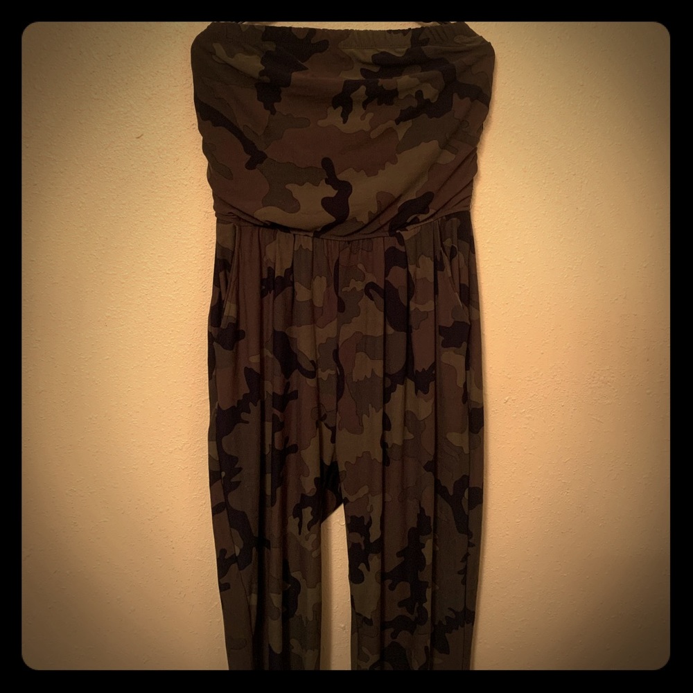 Camouflage halter jumpsuit stops at calf.